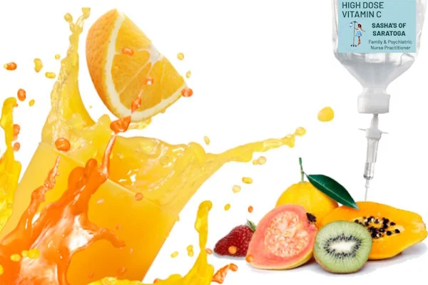 High Dose Vitamin C - fruits rich in vitamin C behind orange juice squirting from orange wedge