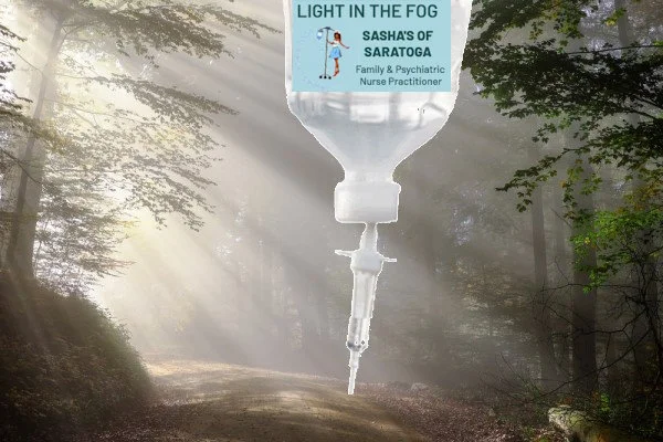 Light in the Fog -Foggy Forest with sunlight shining through and IV bag in foreground