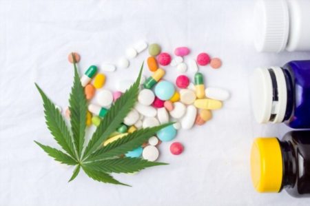 Cannabis leaf and pills